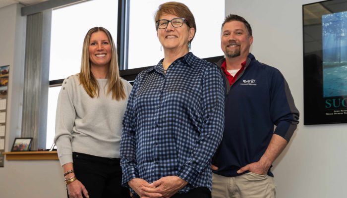 Monroe Tractor’s CEO, Janet Felosky with her children, Laura WIlkas, Marketing Director and Chris Felosky, President.
